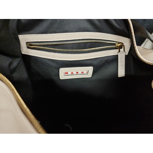 86 - Star Lot : A brand new ladies designer holdall handbag by Marni. Designed in a cream toned calf leat... 