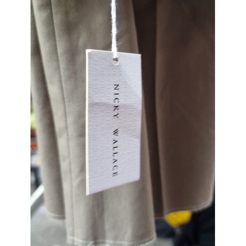 119 - A pair of tan Nicky Wallace Italian made men's suit trousers, brand new with original tags intact. E... 