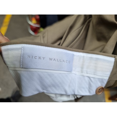 121 - A pair of khaki Nicky Wallace Italian made men's trousers, brand new with original tags intact. EU s... 