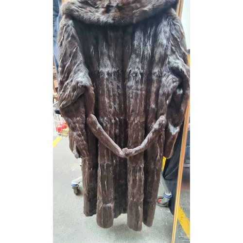 134 - Star lot : A wonderful women's full length genuine fur coat with beautiful lining to interior with d... 