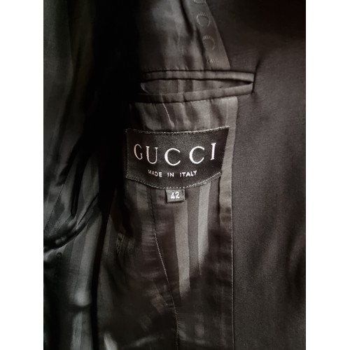 209 - Star Lot : An outstanding women's two piece suit by Italian designer Gucci. Consists of a finely tai... 