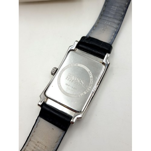 235 - A designer Boss tank style silver faced wrist watch. This example features baton dial, luminous hand... 