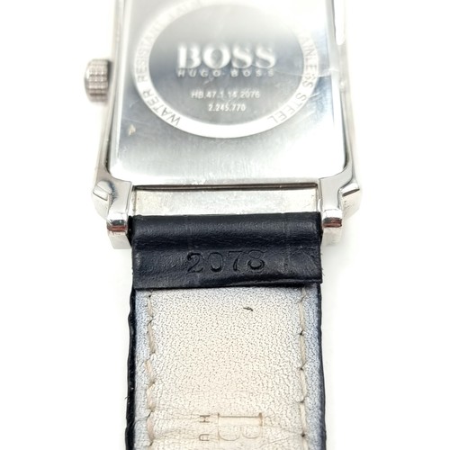 235 - A designer Boss tank style silver faced wrist watch. This example features baton dial, luminous hand... 