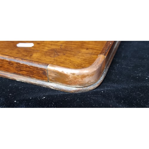 296 - A stunning antique mahogany Butler's tray with copper corners. Boasts excellent craftmanship, in ori... 