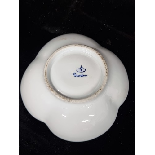 322 - A wonderful 19th century Dresden porcelain cup and matching saucer both of the quatrefoil form and f... 