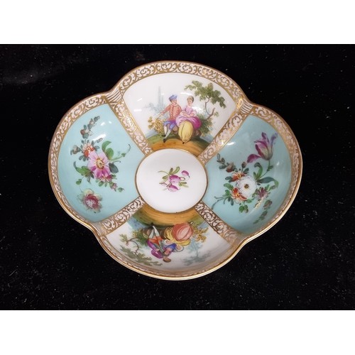 322 - A wonderful 19th century Dresden porcelain cup and matching saucer both of the quatrefoil form and f... 