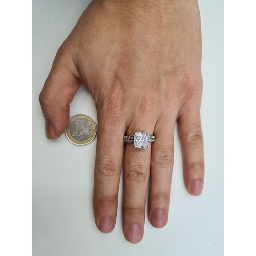 696 - A fine example of a vintage sterling silver Zirconia ring, with gem stone mount. Together with a mat... 