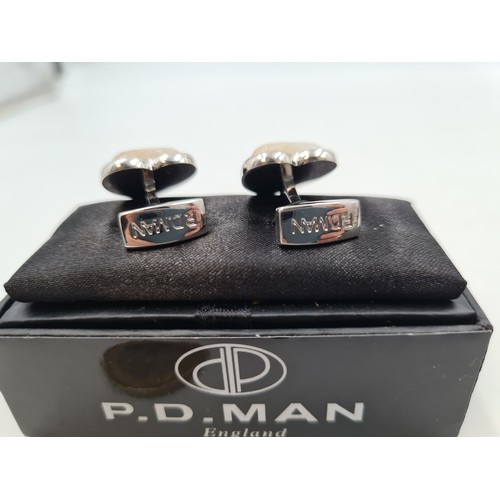 701 - A pair of Chanceldony stone heart shaped cuff links, by the designer P. W man. Presented in a gift b... 