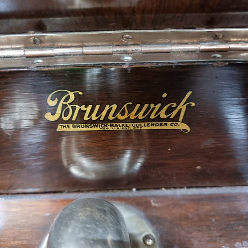 690 - A very handsome Brunswick branded vintage Gramaphone cabinet . A self integrated example housed in a... 