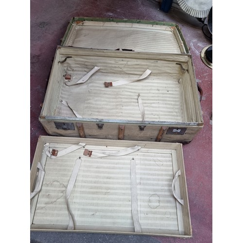 831 - An amazing Flaxite Foundation suitcase with two tiers to interior. Features wooden banding and leath... 