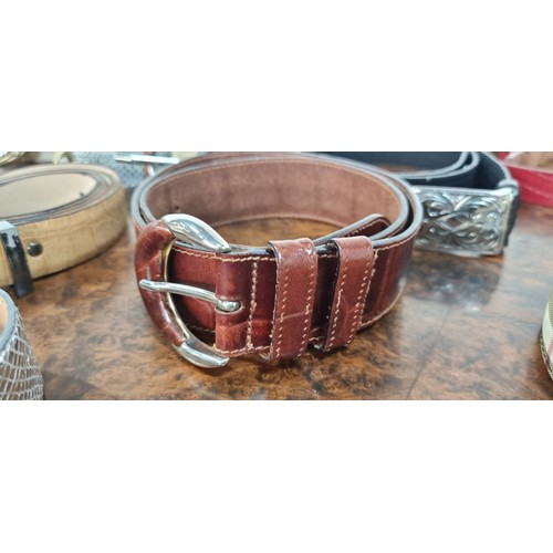 226 - A large basket of twenty eight high quality leather belts. Including largely genuine leather example... 