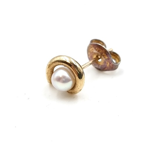 704 - A pair of 9 carat Gold Pearl stud earrings. Presented in a gift box.