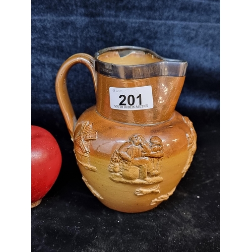 201 - A charming antique stoneware jug. Featuring relief images of windmills, ale drinkers and a hunt. Top... 