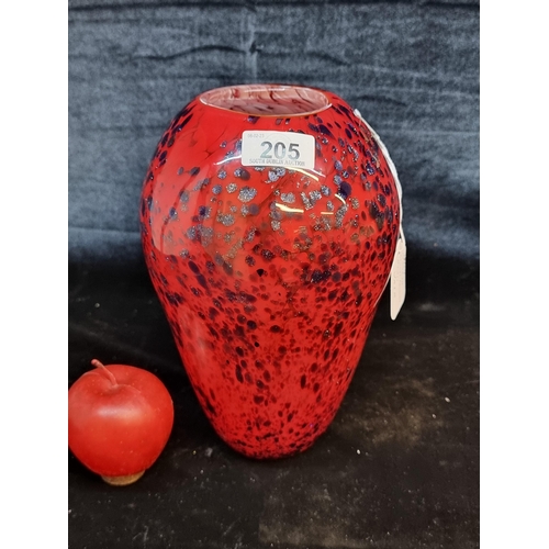 A beautiful handblown Art Glass vase. Designed with elegant form in shades of red with glittering purple design. Standing on a small base with attractive high shoulders. H25cm