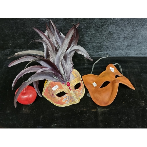 266 - A pair of authentic Venetian masks both by maker Ca Macana, Venice. Including one moulded leather ca... 