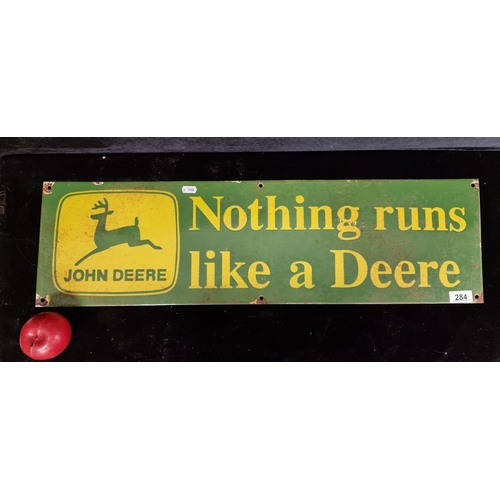 284 - A large heavy vintage enamel wall sign advertising John Deere machinery reading the text 