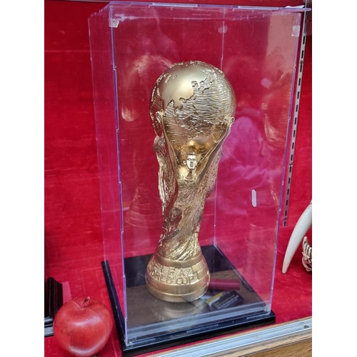 342 - A gilded replica of the FIFA World Cup Jules Rimet trophy. Housed in a tall presentation box.