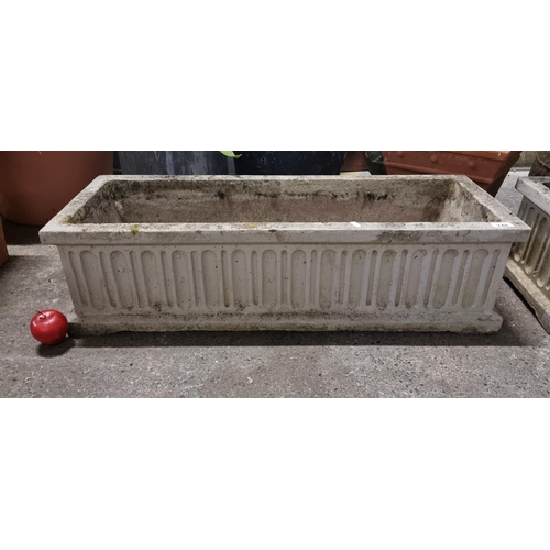 749 - A large rectangular trough planter. A very heavy example in reconstituted stone. With recessed geome... 