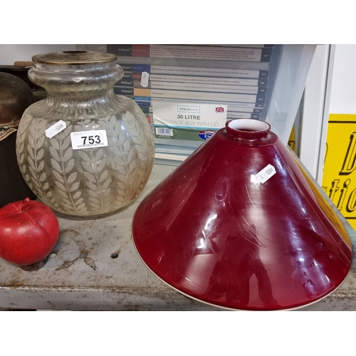 753 - Two vintage lampshades including a conical example with red glass overlay. Supplied with a bauble la... 