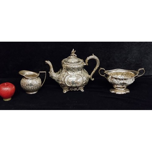 288 - A set of highly decorative 19th century EPNS ware including a particularily teapot with bird finial ... 