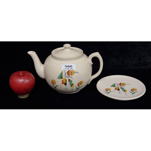 290 - A very cool ceramic Carrigware teapot and tea pot stand with attractive art deco style geometric flo... 