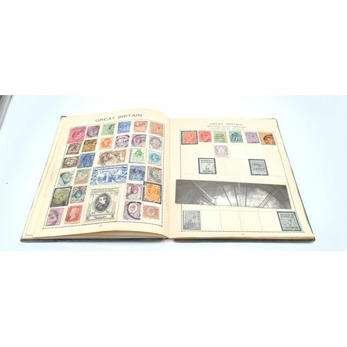 61 - An antique hardback stamp album 