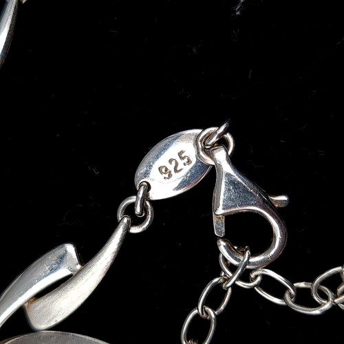 65 - An attractive sterling silver interlinked necklace by designer 