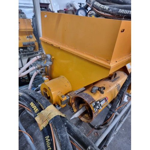 A Wagner T25K vertical continuous mixer for plaster spraying. Complete ...