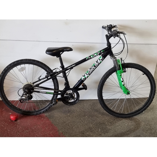 A fantastic Apollo Gridlock junior mountain bike in a very cool green black colourway and equippe