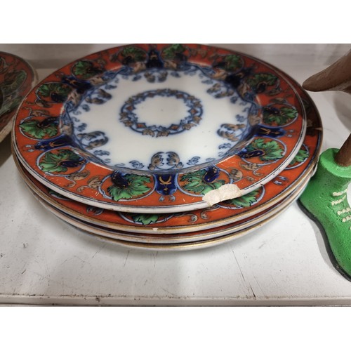 147 - A collection of nine matching antique serving ware pieces including five dinner plates, a smaller an... 