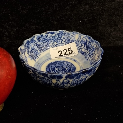225 - A beautiful antique flow blue porcelain Japanese bowl with a nice scalloped edge and painted with tr... 