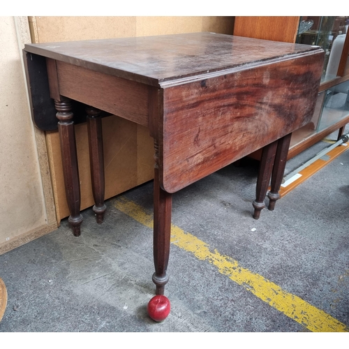 482 - A very handsome example of an antique 19th century drop leaf flame mahogany table. An understated, y... 