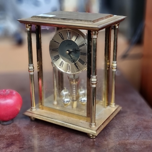 486 - A lovely vintage West German mantel clock with quartz movement and housed in a brass box frame.