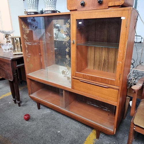 489 - A charming glazed mid century teak display cabinet. With sliding glass doors, deep pull out drawer, ... 