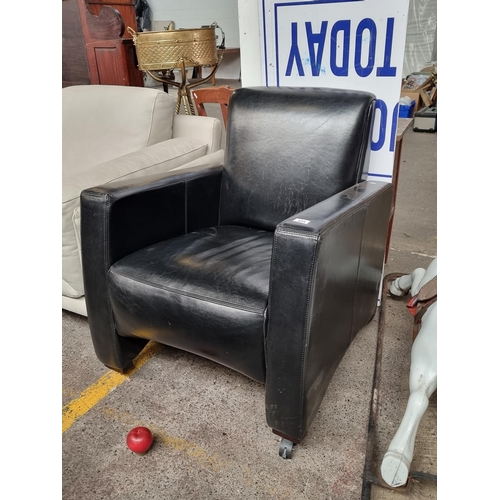 494 - A very stylish black leather armchair with a wonderful contemporary aesthetic. Very comfortable. In ... 