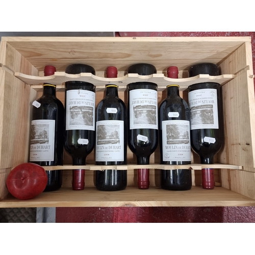 502 - Star Lot : A wooden display box containing six sealed bottles of 2004 Moulin De Duhart, Paulillac. F... 