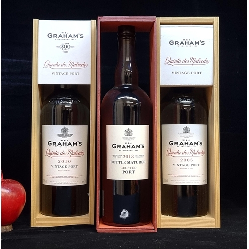 545 - Three sealed bottles of Graham's port. Including a 2005 and 2010 Quinta Dos Malvedos. With a 2013 Bo... 