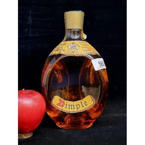 560 - A sealed 1960's bottle of Haig's Dimple Scotch Whiskey. A fabulous example with original labels and ... 