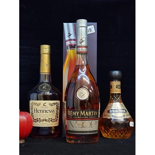 569 - Three sealed bottles of Irish cognac. Including a 70cl Rémy Martin Mature Cask Finish example in pre... 