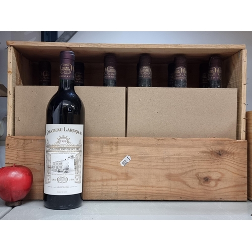 577 - A wooden case containing eleven sealed bottles of 1989 Chateau Laroque Saint-Émilion Grand Cru (75cl... 