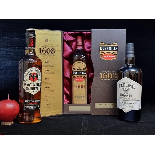 581 - Three sealed bottles of alcoholic beverages including a 70cl 400th anniversary edition of Bushmills ... 