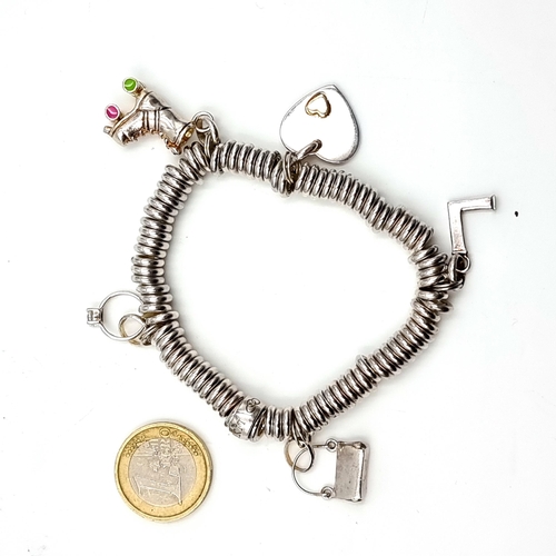 645 - A Links of London five charm sterling silver bracelet in presentation box.
Weight: 60.29 grams.