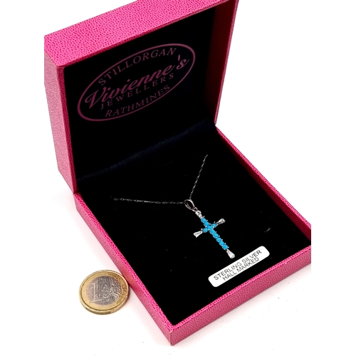 649 - A sterling silver pendant cross necklace with turquoise and gemstone setting, in original presentati... 