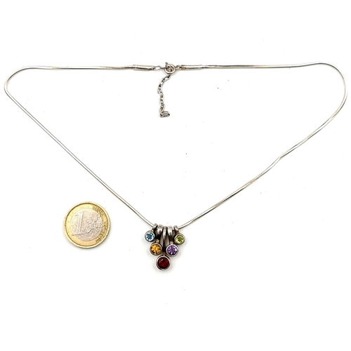 651 - An attractive garnet amethyst citrine and topaz drop pendant on a sterling silver chain.
Length of c... 