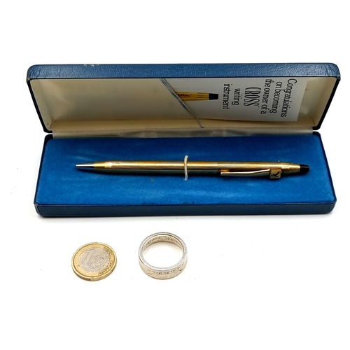 652 - A Cross gold plated ball point pen in original presentation case, together with a half dollar coin r... 