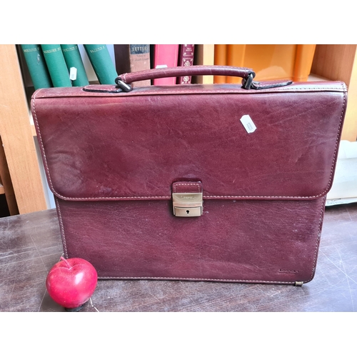 864 - A very smart high quality leather briefcase made by Lorpel. Features handle to top with lockable lat... 