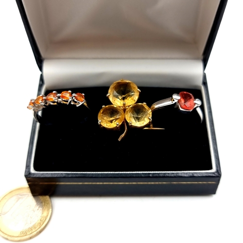 881 - A nice collection consisting of a citrine three stone shamrock brooch with pin intact. Together with... 