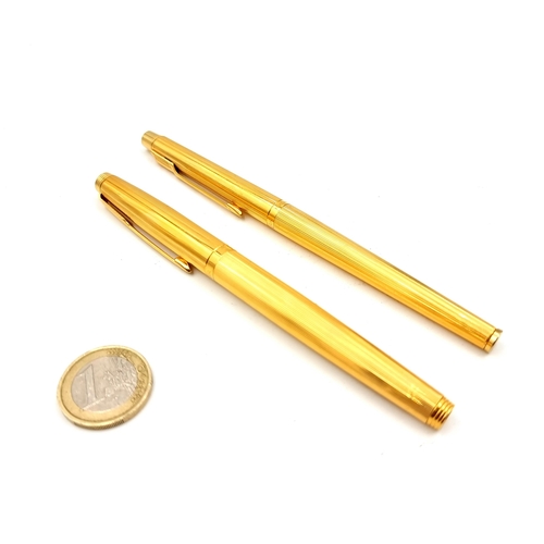 889 - Two vintage gold plated Parker roller ball pens, each with machine cut finish. In excellent conditio... 