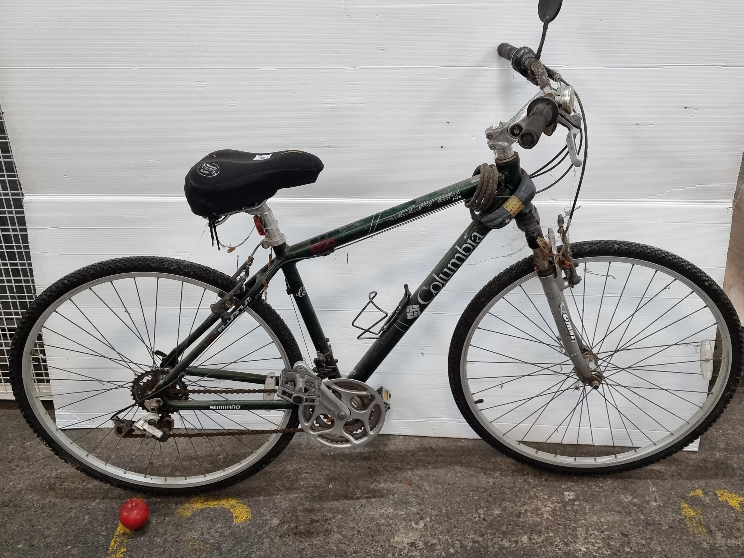 A Columbia Journey HX bicycle with Shimano gears and Sram Max twist shifter. Equipped with a comfo