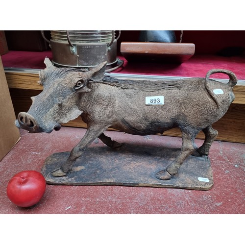 893 - Star lot : A characterful hand carved wooden sculpture of the sub-saharan african warthog, posed mid... 